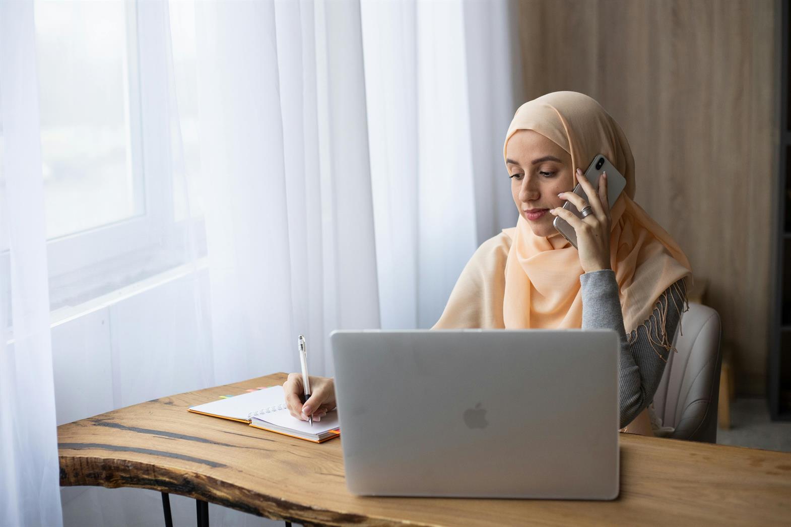 A woman scheduling an appointment over the phone