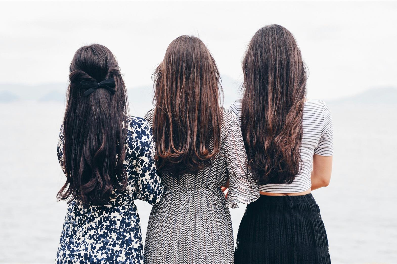 three women overlooking water