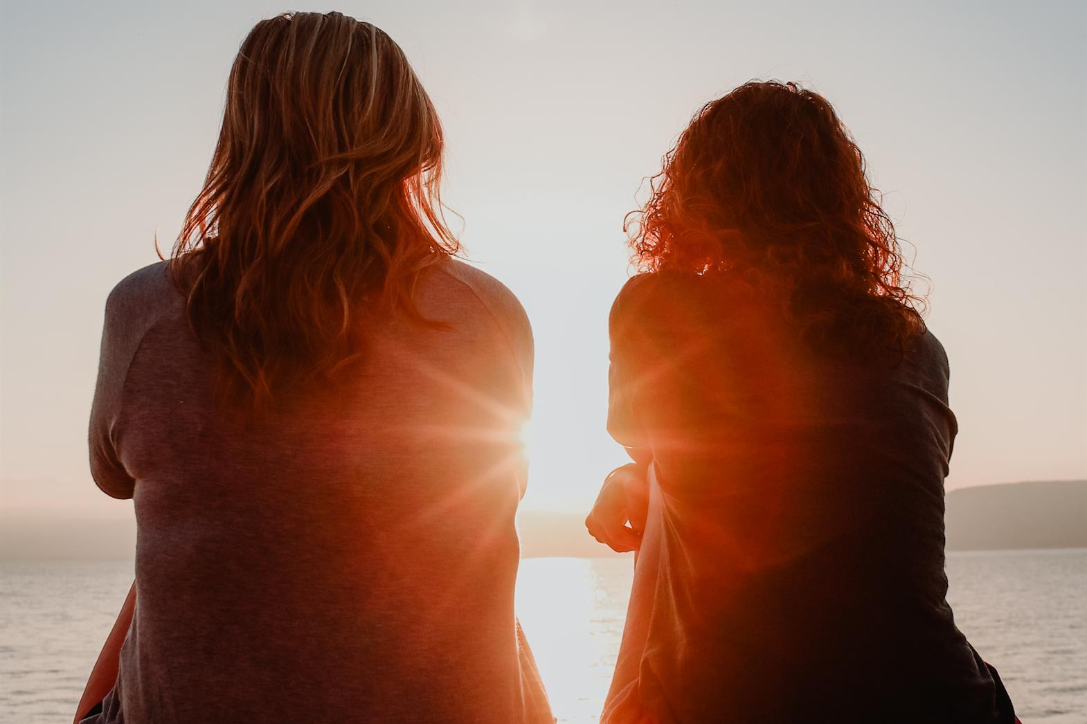 Two people watching the sunset together