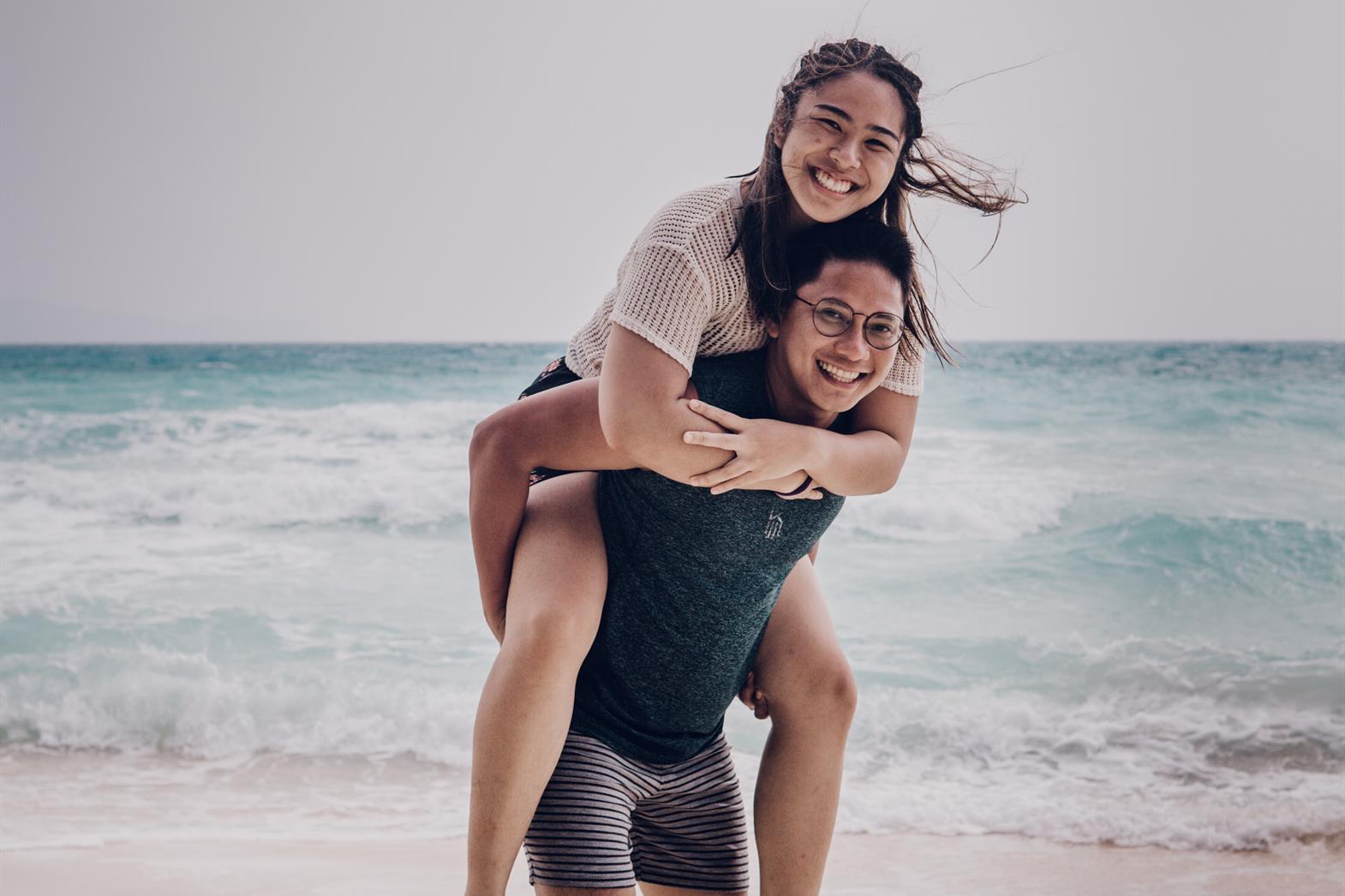 A man and woman on a beach