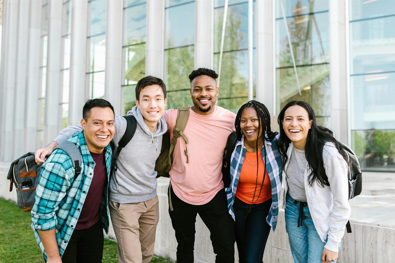 College students standing together in front of a building