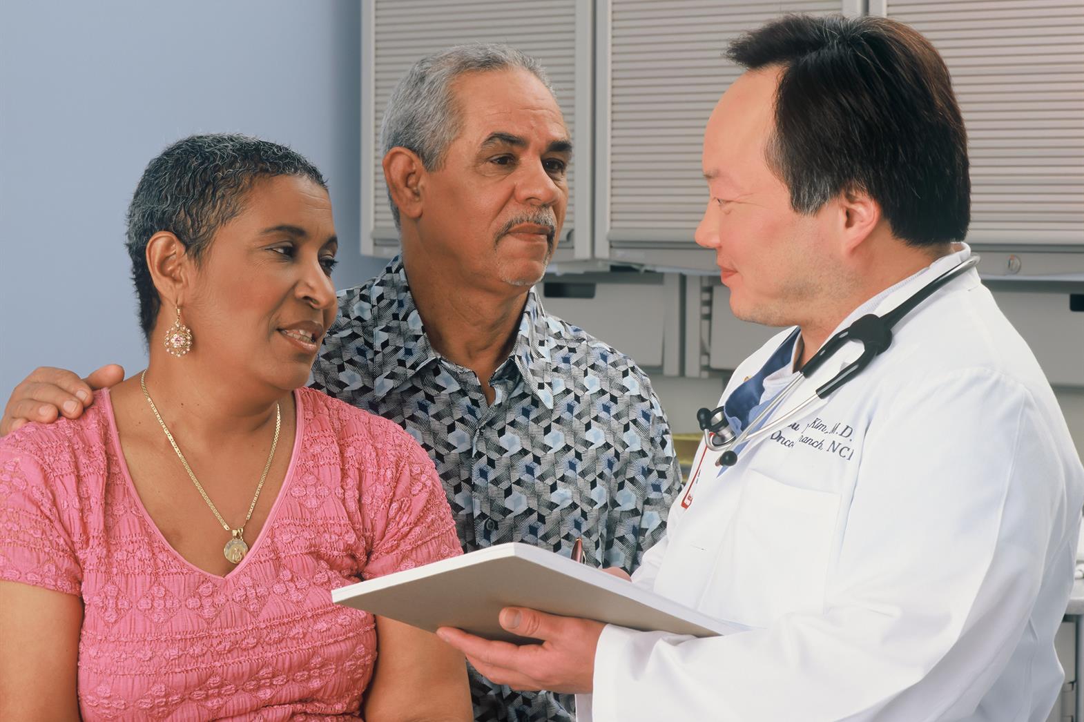A couple speaking to a doctor